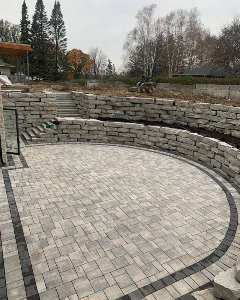 Stone Retaining Wall and Patio by Artech